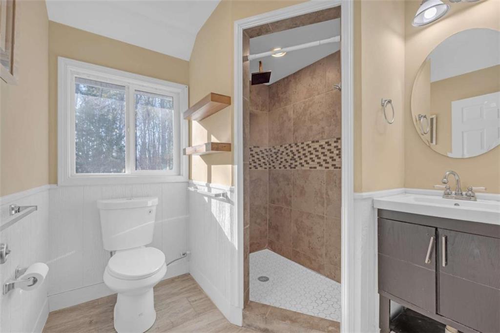 1256 Chambers Road McDonough, GA 30253 - Photo 21 of 49 a bathroom with a toilet a sink and shower