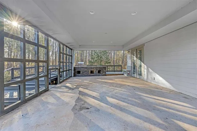 a kitchen with stainless steel appliances kitchen island granite countertop a refrigerator and a stove top oven