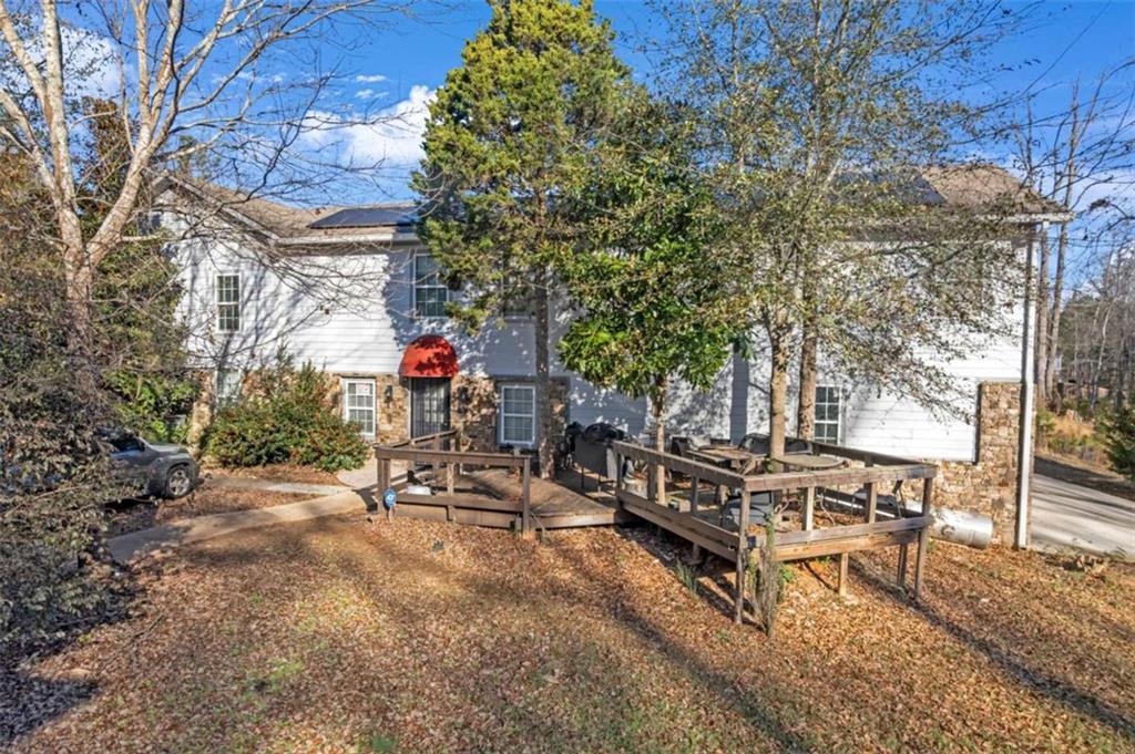 1256 Chambers Road McDonough, GA 30253 - Photo 29 of 49 a backyard of a house with fire pit and outdoor seating