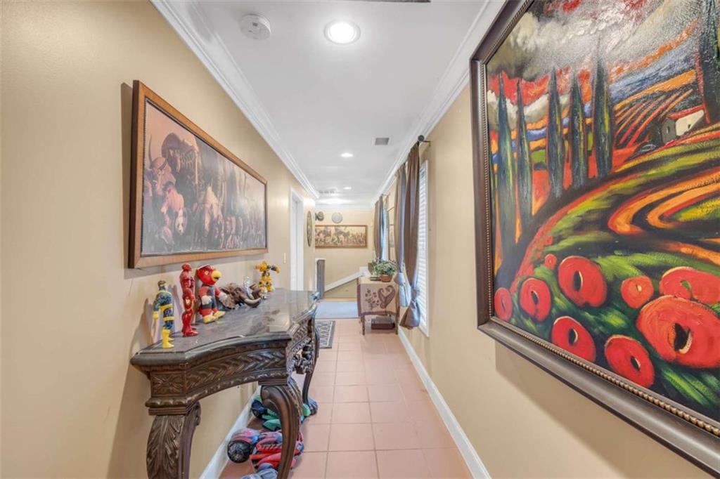 1256 Chambers Road McDonough, GA 30253 - Photo 34 of 49 a living room with furniture and baby crib