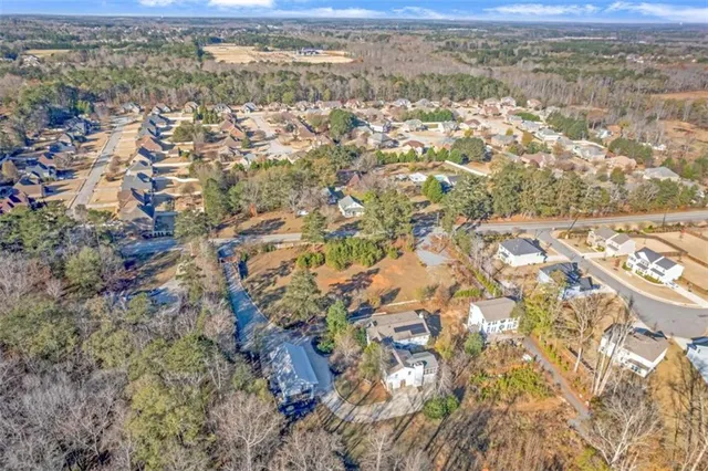 a backyard of a house with large trees