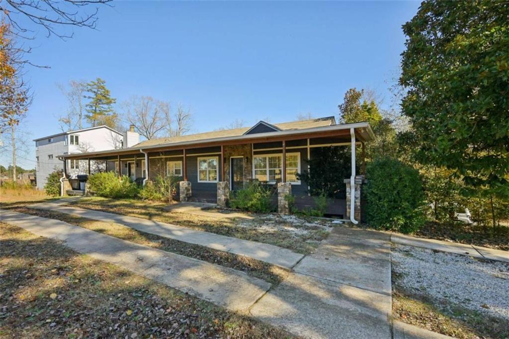 1256 Chambers Road McDonough, GA 30253 - Photo 47 of 49 a front view of a house with a yard outdoor seating and garage