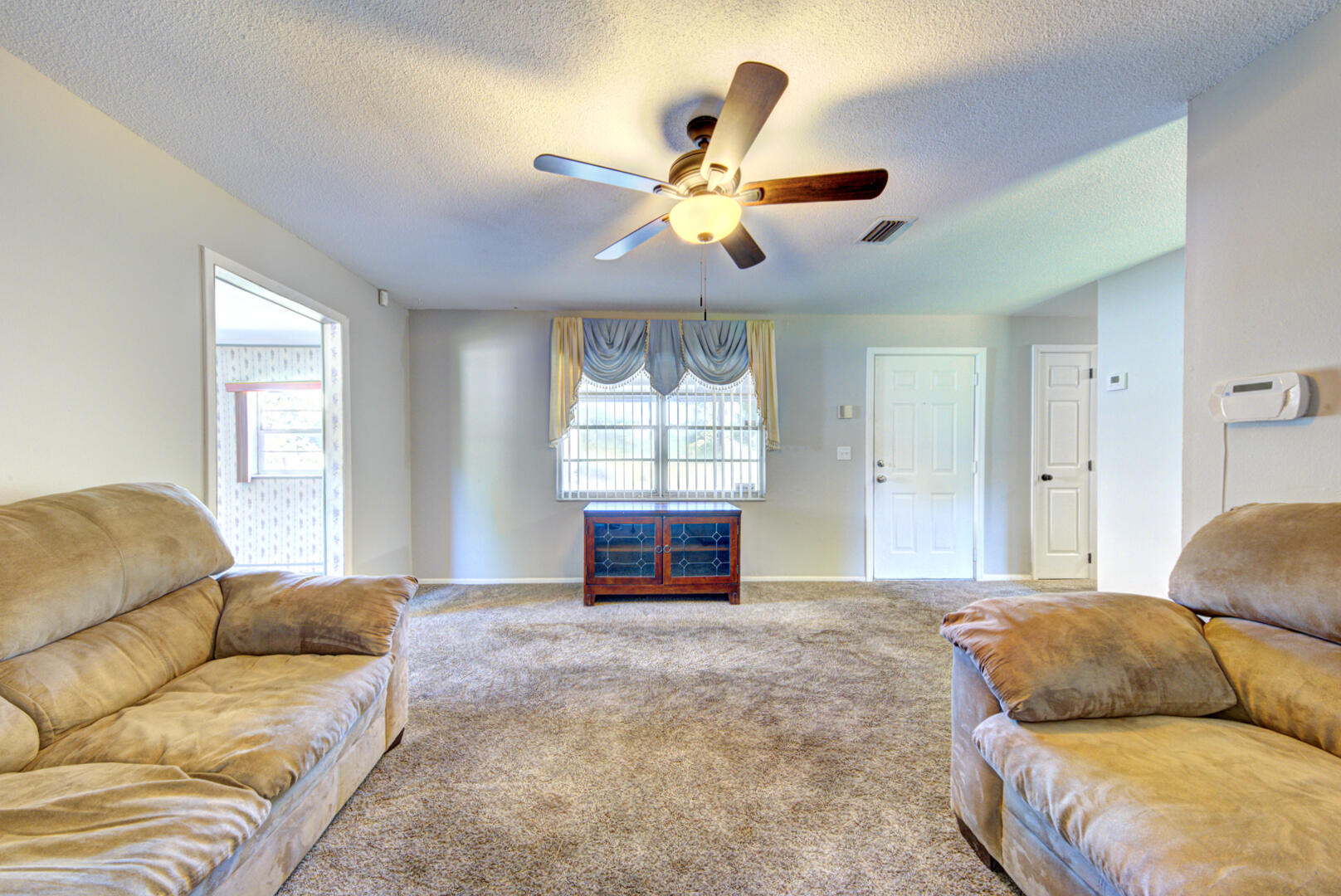 3579 Ridgeway Avenue Mims, FL 32754 - Photo 26 of 28 living room with fan