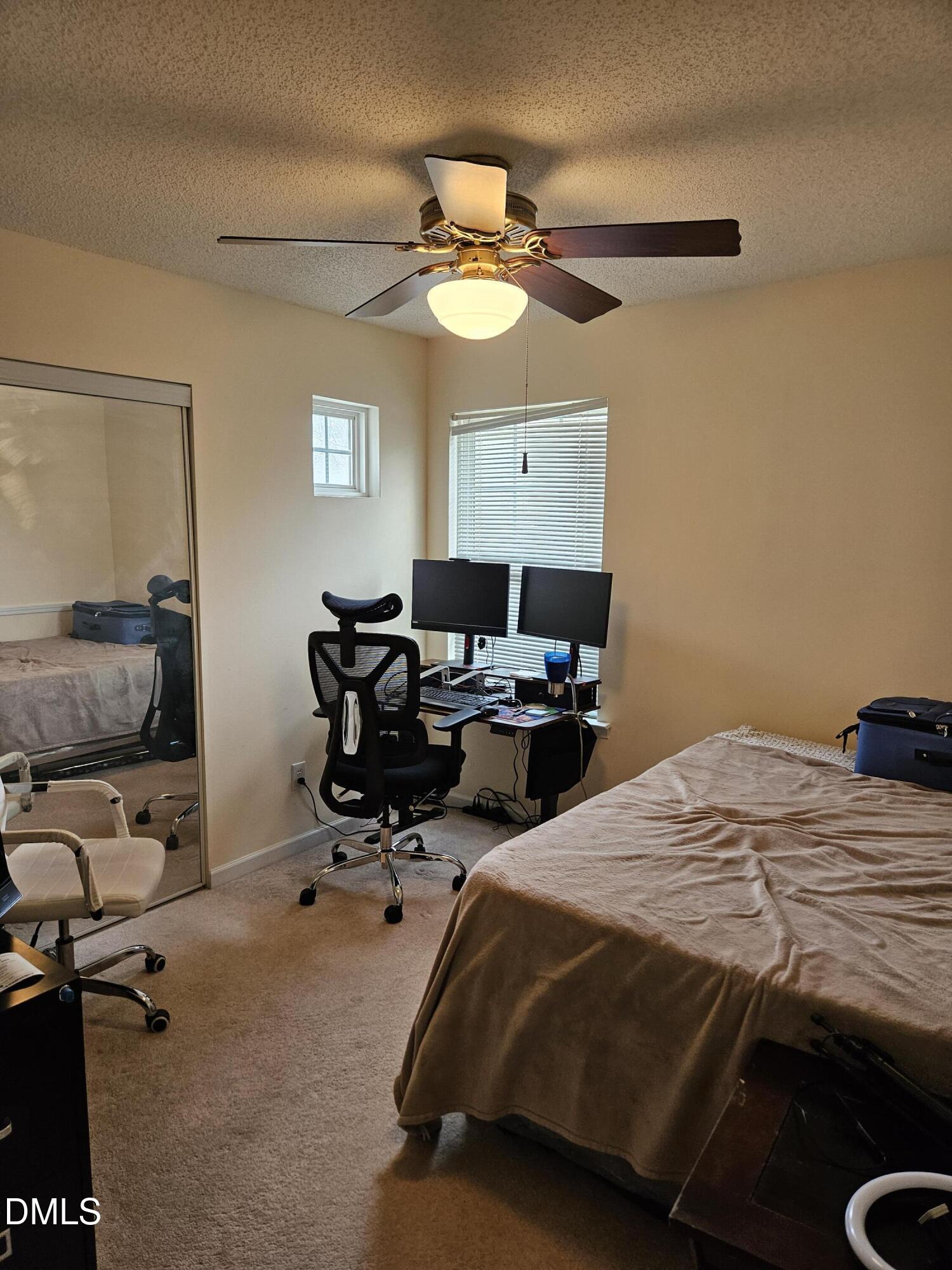 5201 Golden Moss Trail Raleigh, NC 27613 - Photo 6 of 10 a bedroom with bed a desk and chair
