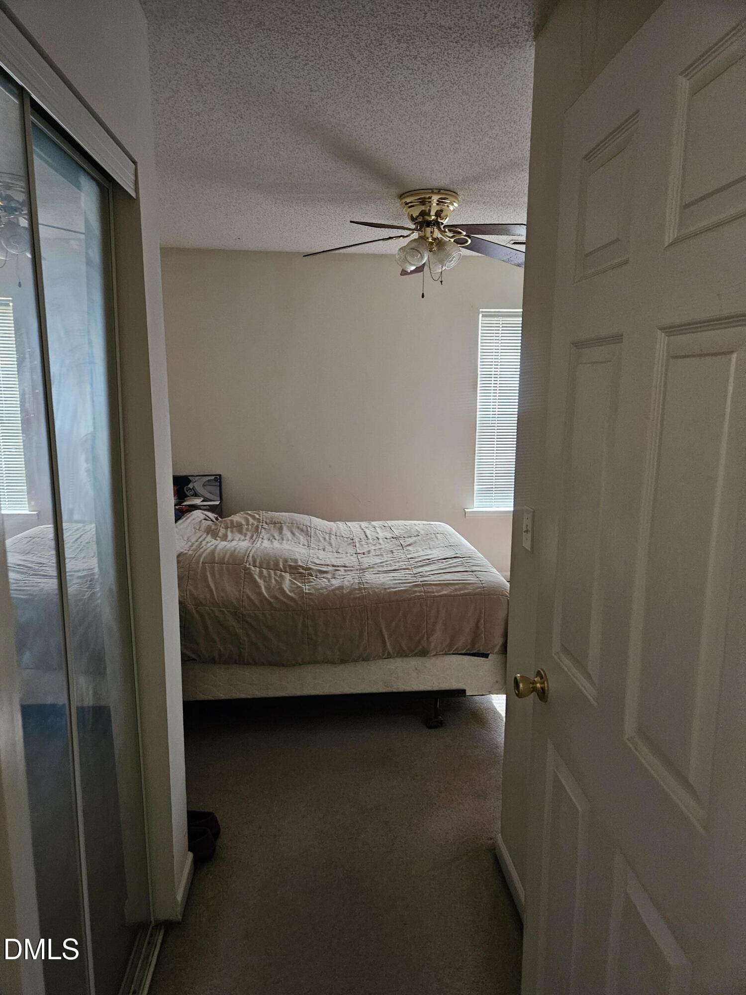 5201 Golden Moss Trail Raleigh, NC 27613 - Photo 10 of 10 a bedroom with a bed and ceiling fan