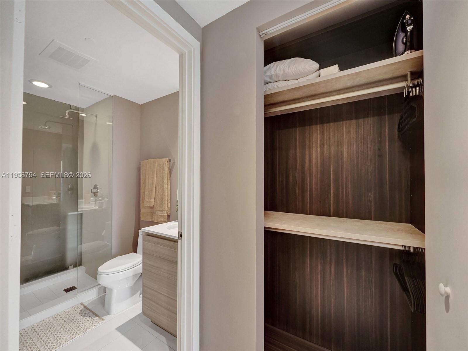 121 Northeast 34th Street, Unit 2106A Miami, FL 33137 - Photo 26 of 59 a bathroom with a toilet and a shower