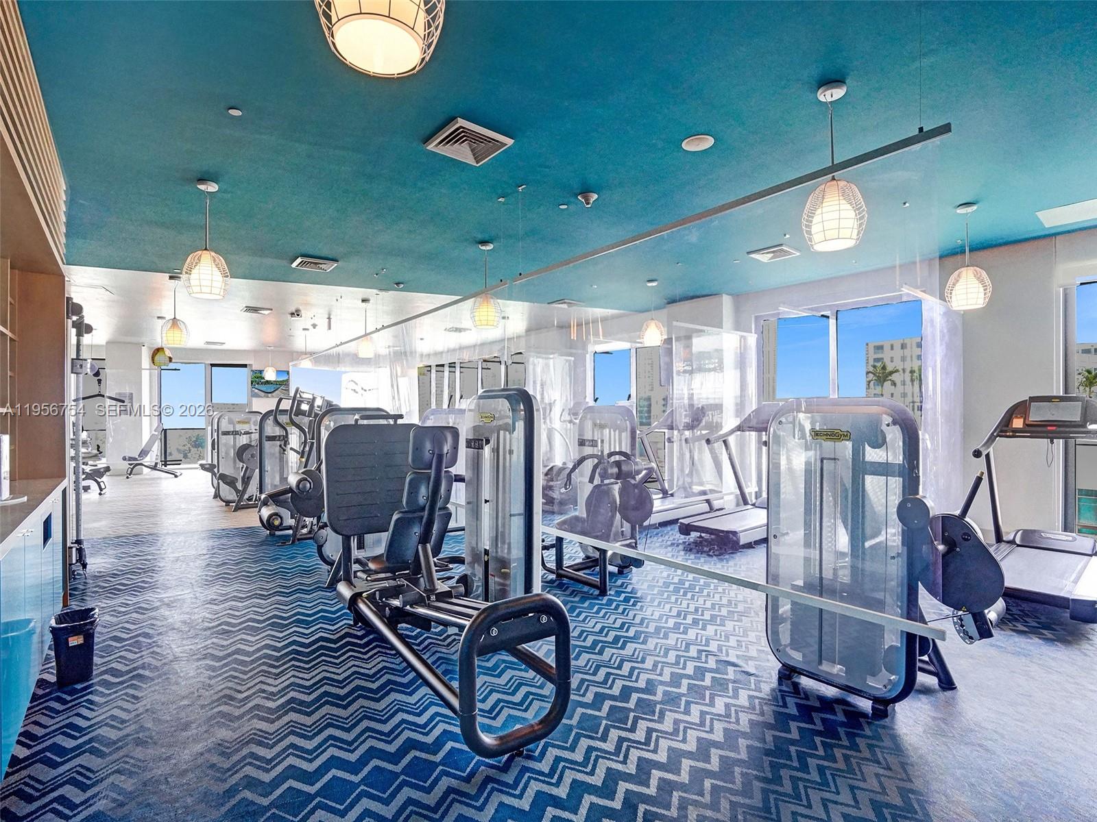 121 Northeast 34th Street, Unit 2106A Miami, FL 33137 - Photo 40 of 59 a view of a room with gym equipment
