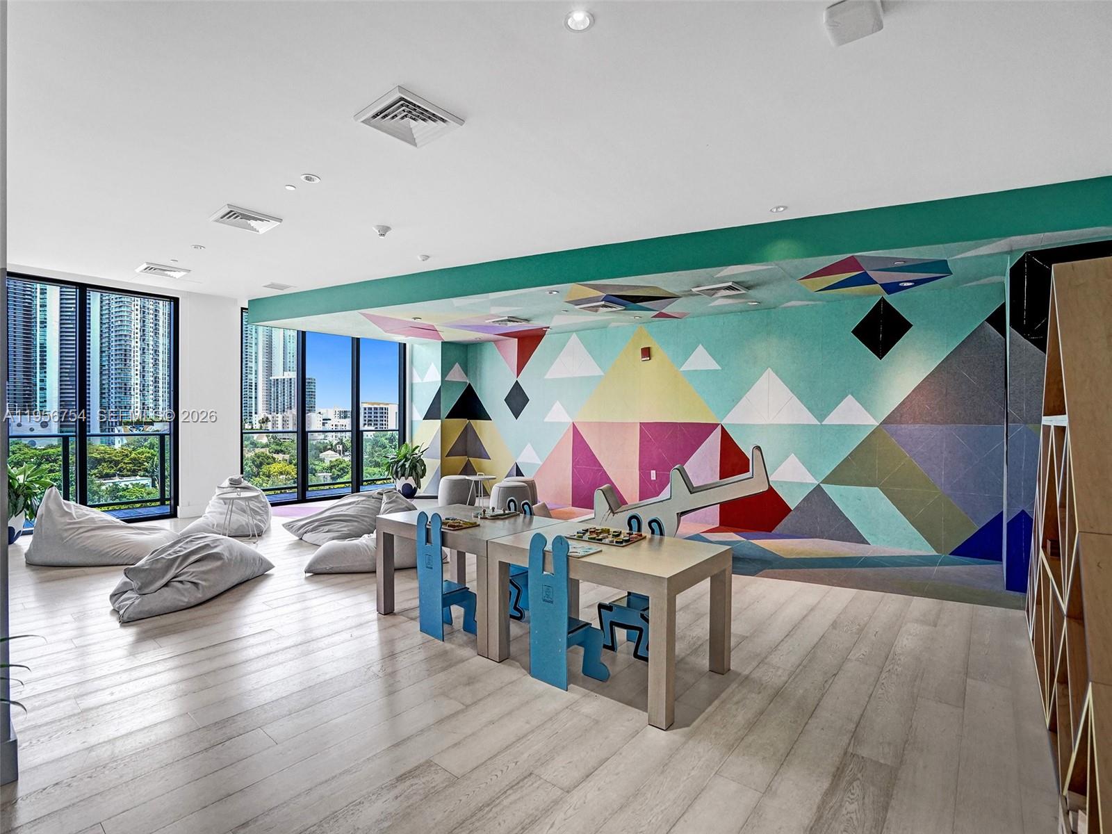 121 Northeast 34th Street, Unit 2106A Miami, FL 33137 - Photo 52 of 59 a room with furniture and a wooden floor