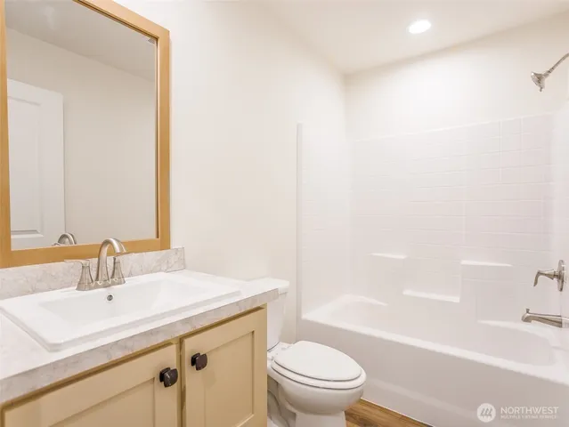 a bathroom with a sink a toilet and a bathtub