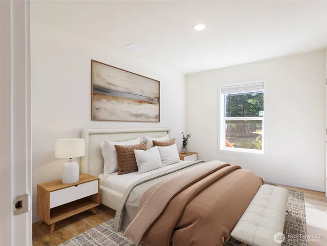 a bedroom with a bed and a window