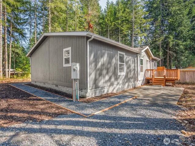 a house with trees in the background