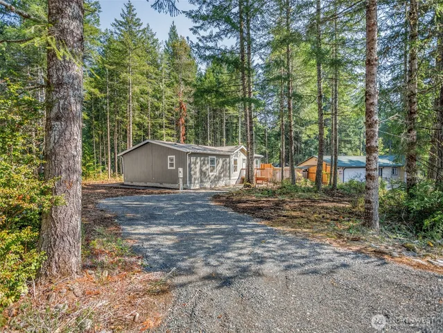 a backyard of a house with lots of green space