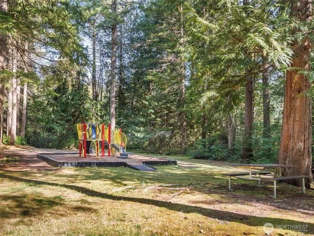 a view of a house with basketball court