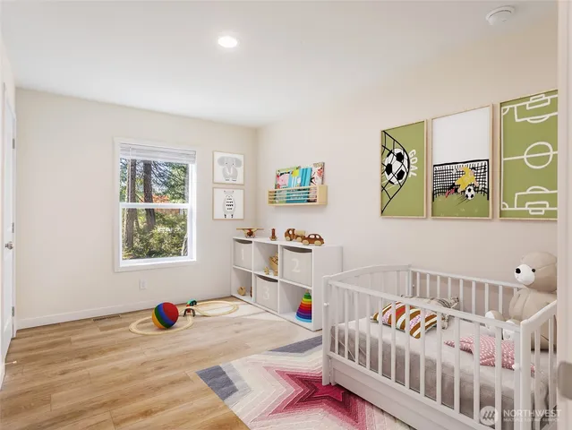 a bedroom with furniture and a window