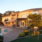 a view of a building with a yard