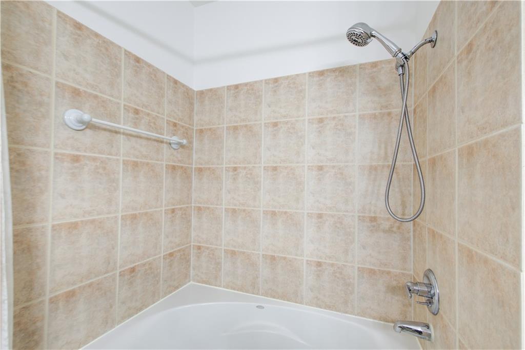 2865 Lenox Road Northeast, Unit 102 Atlanta, GA 30324 - Photo 25 of 35 a bathroom with a shower