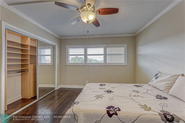 a bathroom with a granite countertop sink a toilet and a mirror