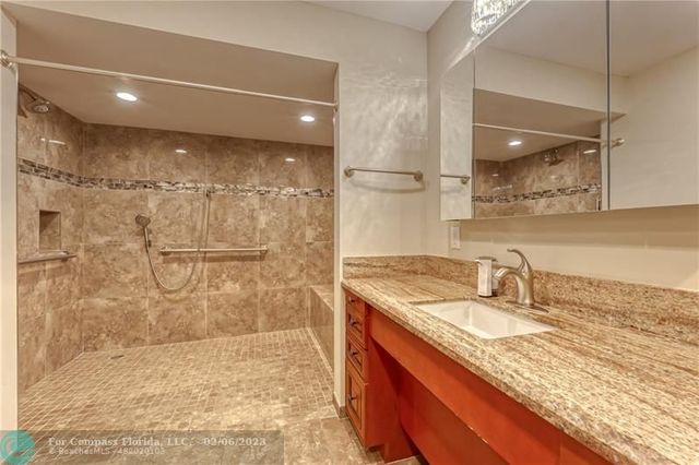 a living room with a bed and a large window