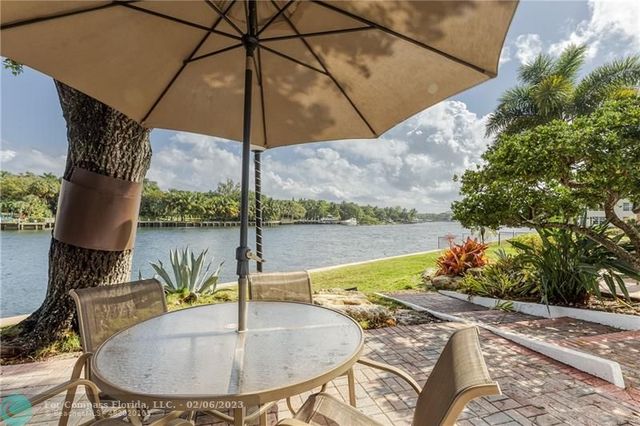 a sign that is on a brick wall