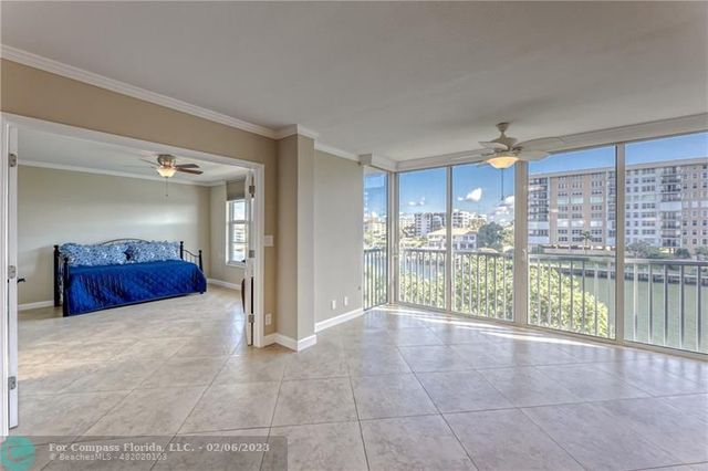 a view of a kitchen with a sink and chandelier
