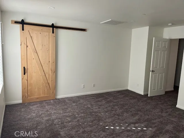 a spacious bathroom with a granite countertop sink a mirror and shower