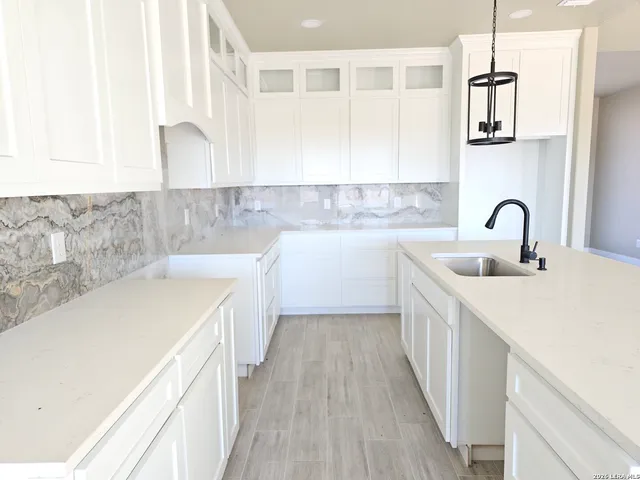 a view of house with yard and ocean view