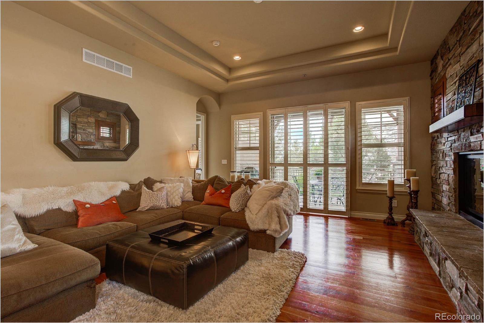 4363 Chateau Ridge Lane Castle Rock, CO 80108 - Photo 11 of 32 a living room with furniture and a large window