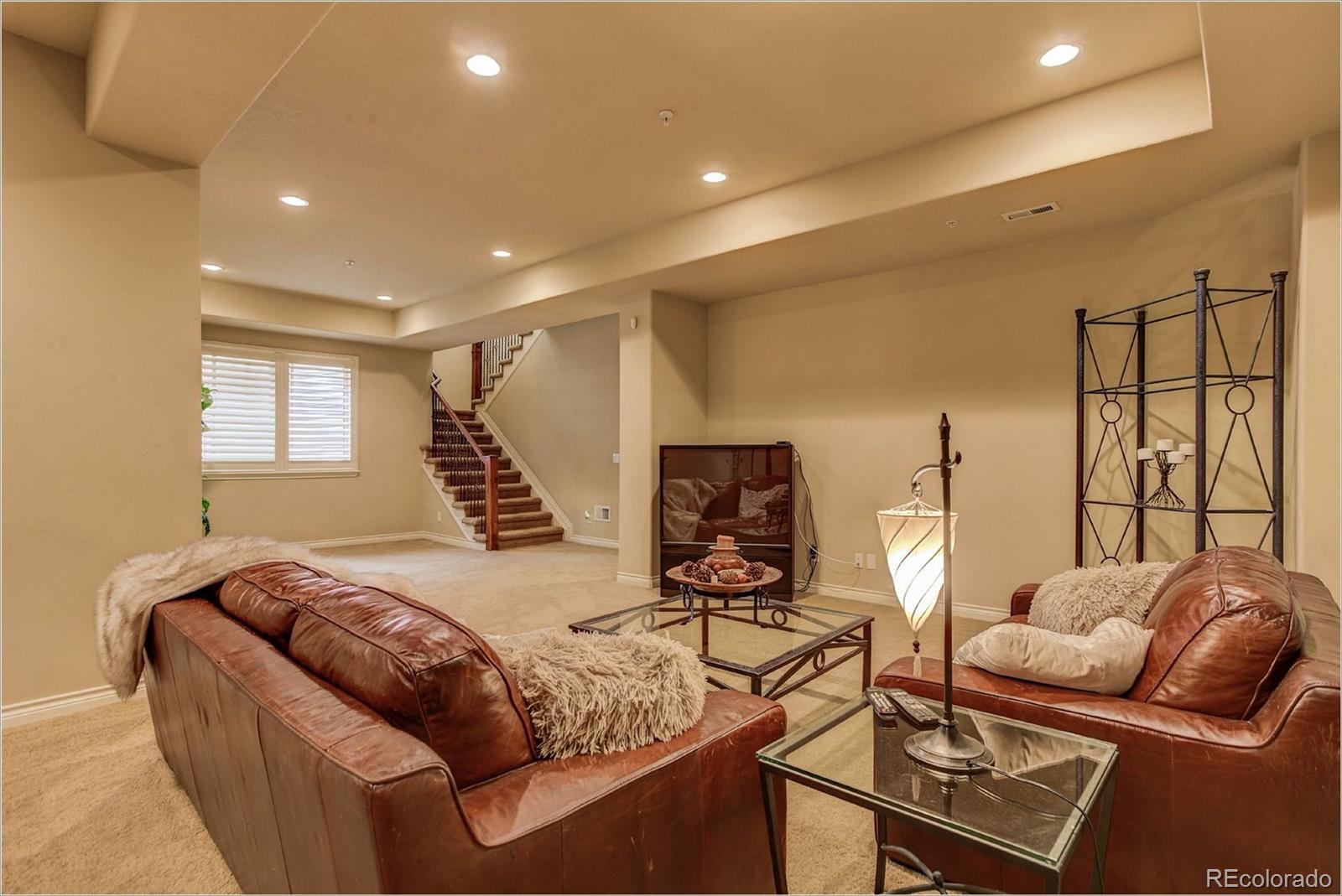 4363 Chateau Ridge Lane Castle Rock, CO 80108 - Photo 13 of 32 a living room with furniture and a large window