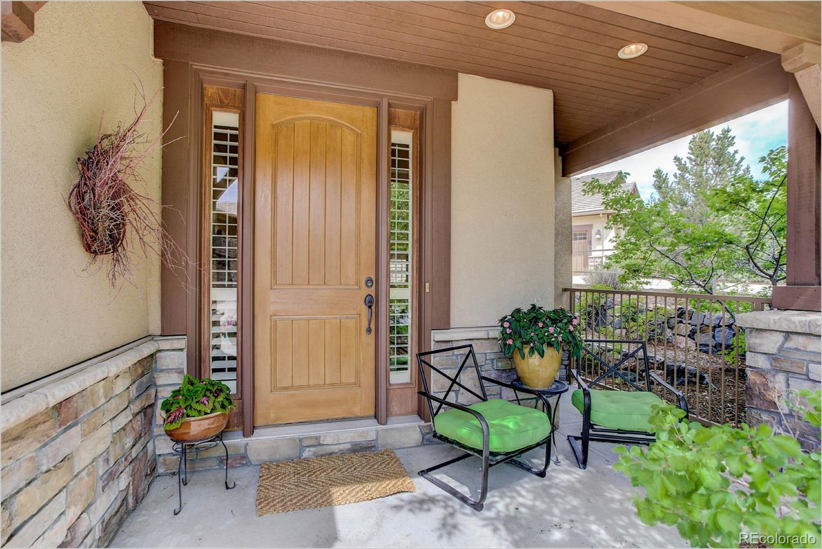 4363 Chateau Ridge Lane Castle Rock, CO 80108 - Photo 2 of 32 a backyard of a house with outdoor seating