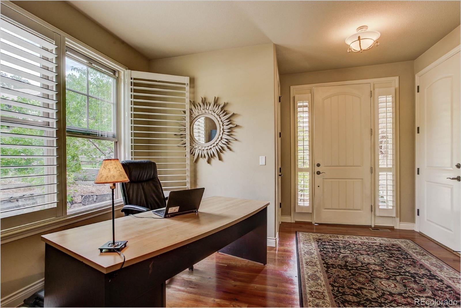 4363 Chateau Ridge Lane Castle Rock, CO 80108 - Photo 3 of 32 a living room with furniture and a window