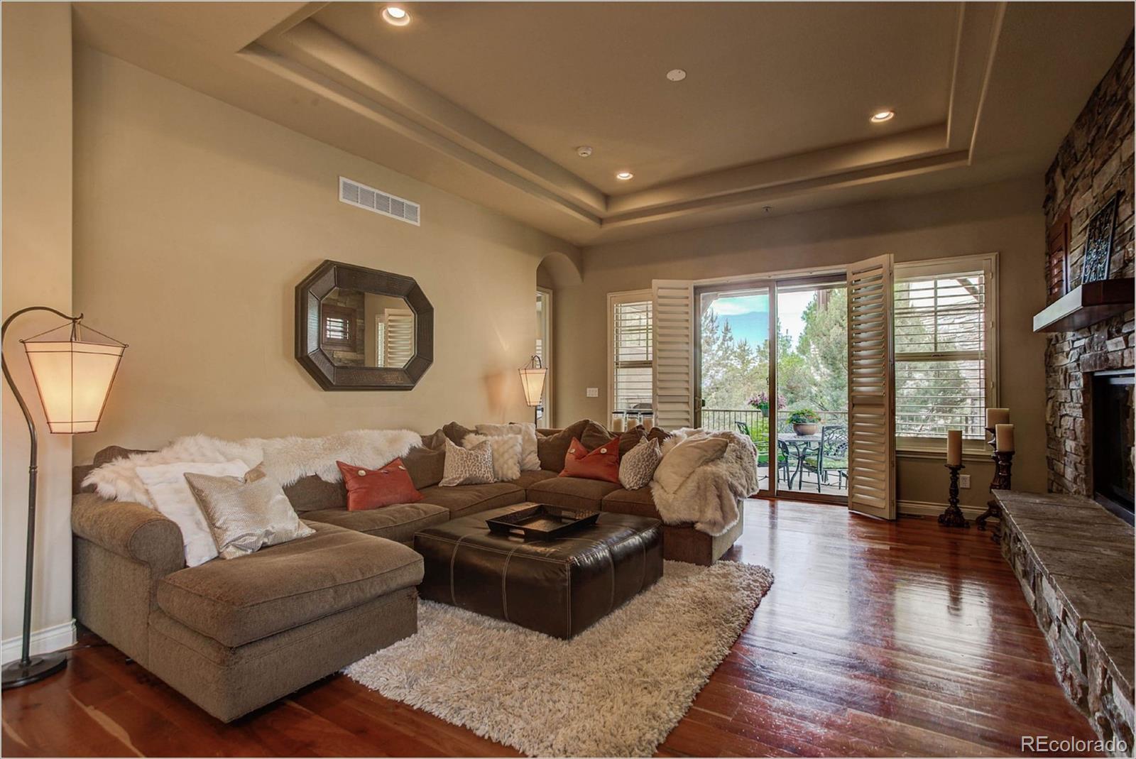 4363 Chateau Ridge Lane Castle Rock, CO 80108 - Photo 9 of 32 a living room with furniture and a large window