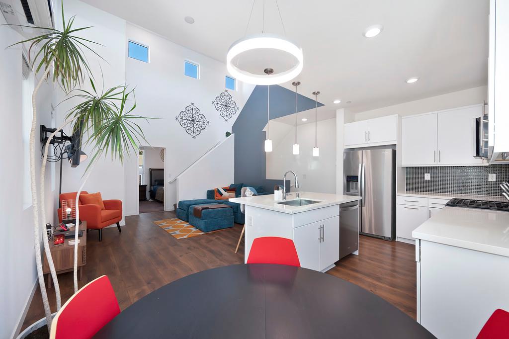216 Box Lane Sacramento, CA 95818 - Photo 6 of 37 a large kitchen with a table and chairs
