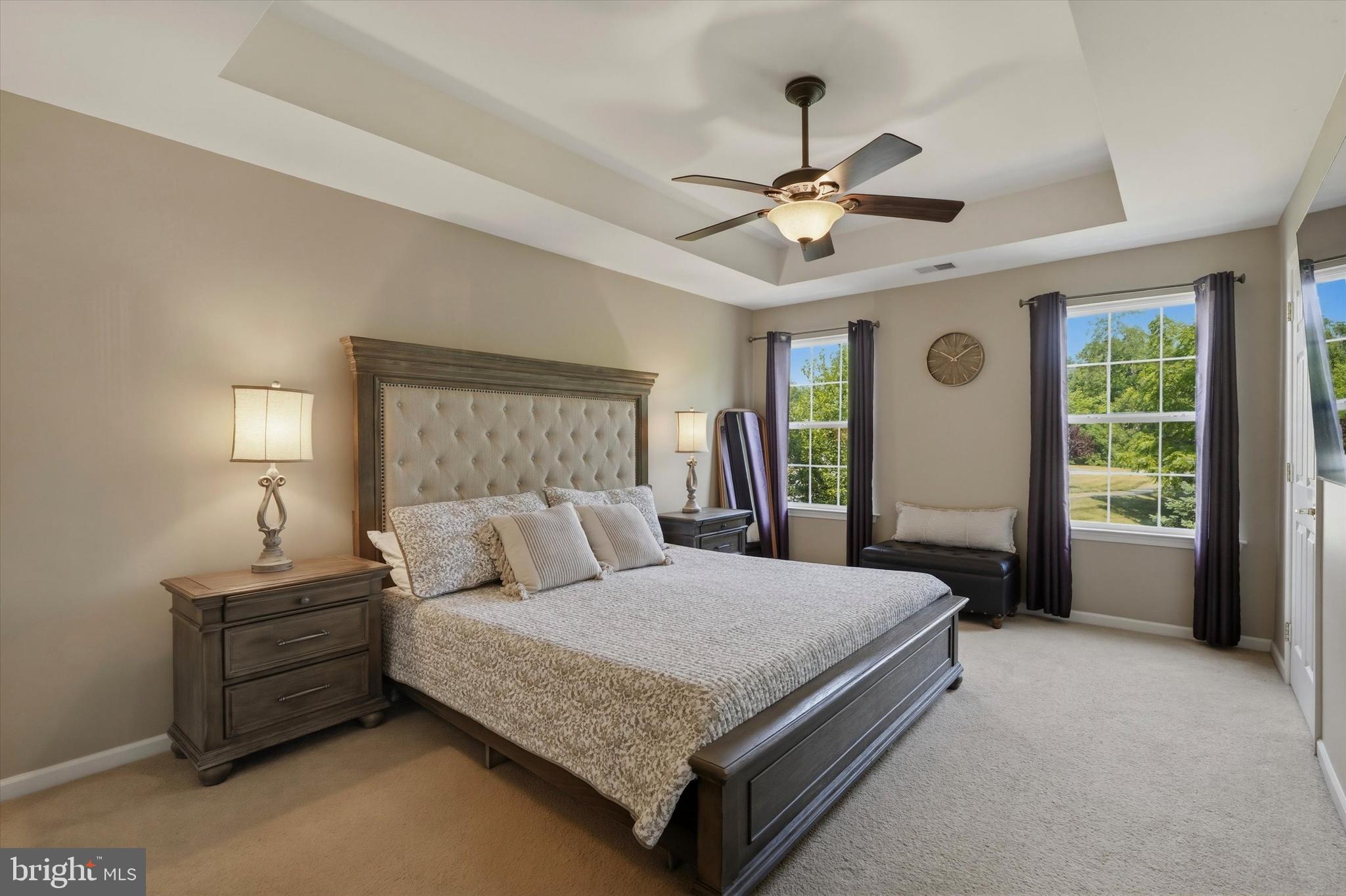 215 Flagstone Road, Unit 1 Chester Springs, PA 19425 - Photo 19 of 33 a bedroom with a large bed and a chandelier fan