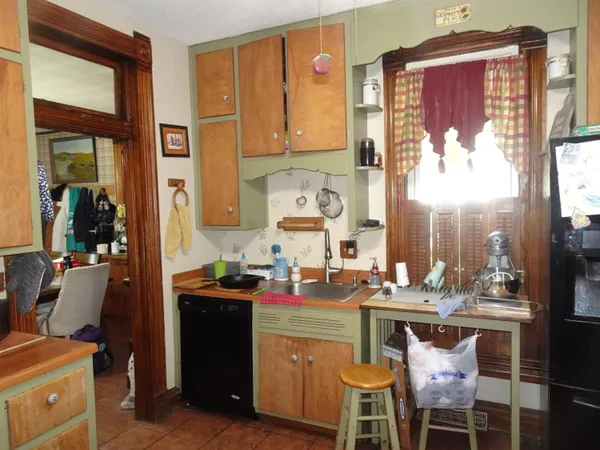 a kitchen with a sink and cabinets