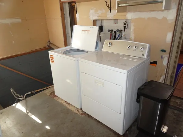 a utility room with dryer and washer