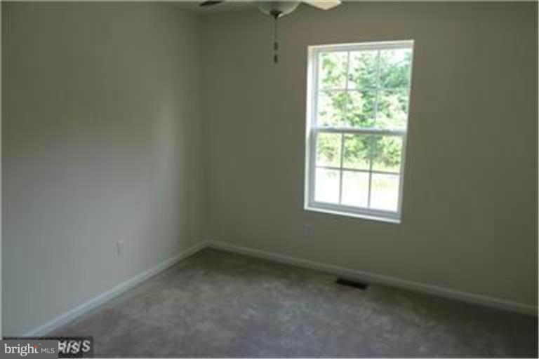 5952 Tyler Road Deale, MD 20751 - Photo 11 of 21 an empty room with a window