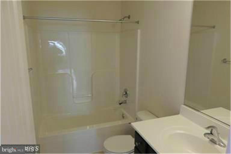 5952 Tyler Road Deale, MD 20751 - Photo 18 of 21 a bathroom with a shower and a sink
