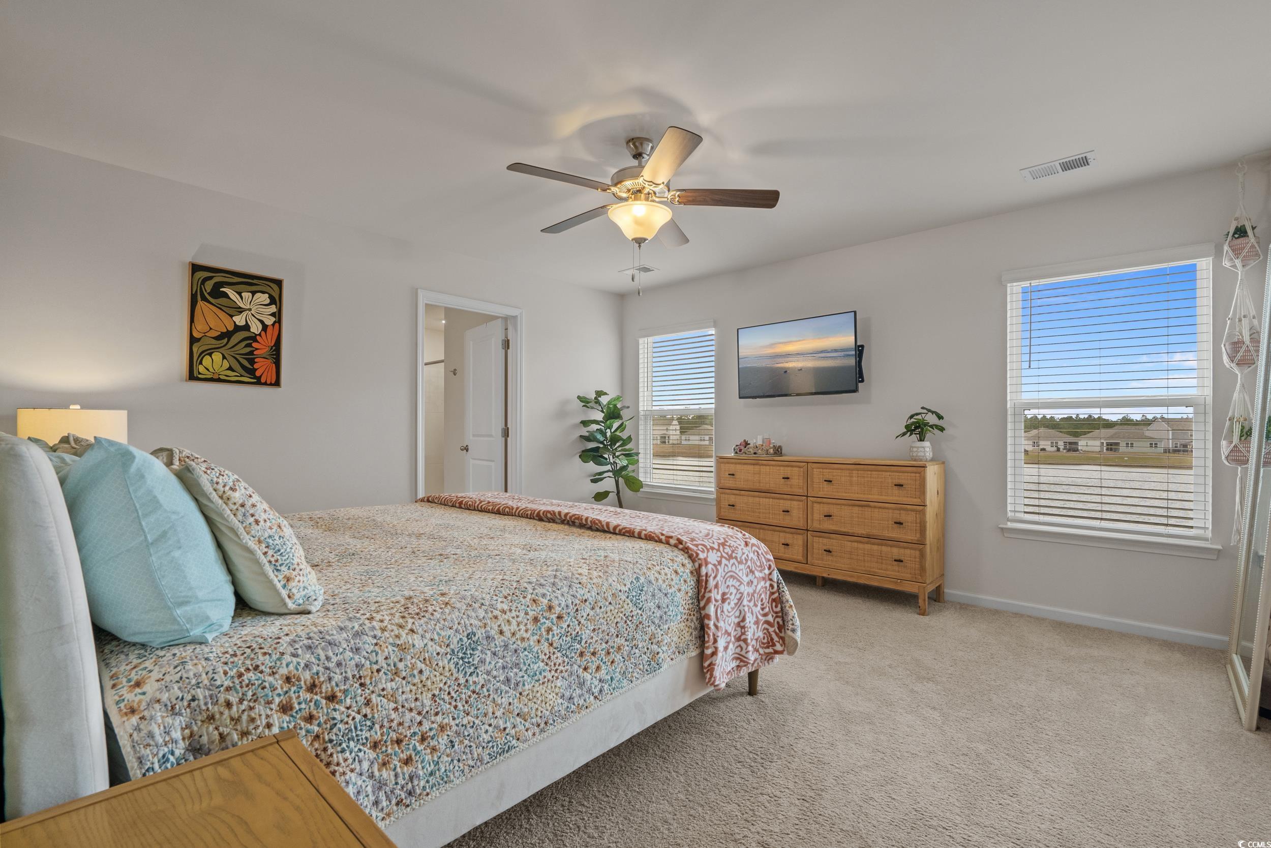 3343 Bells Lake Circle Longs, SC 29568 - Photo 17 of 40 Bedroom featuring light colored carpet and a ceiling fan