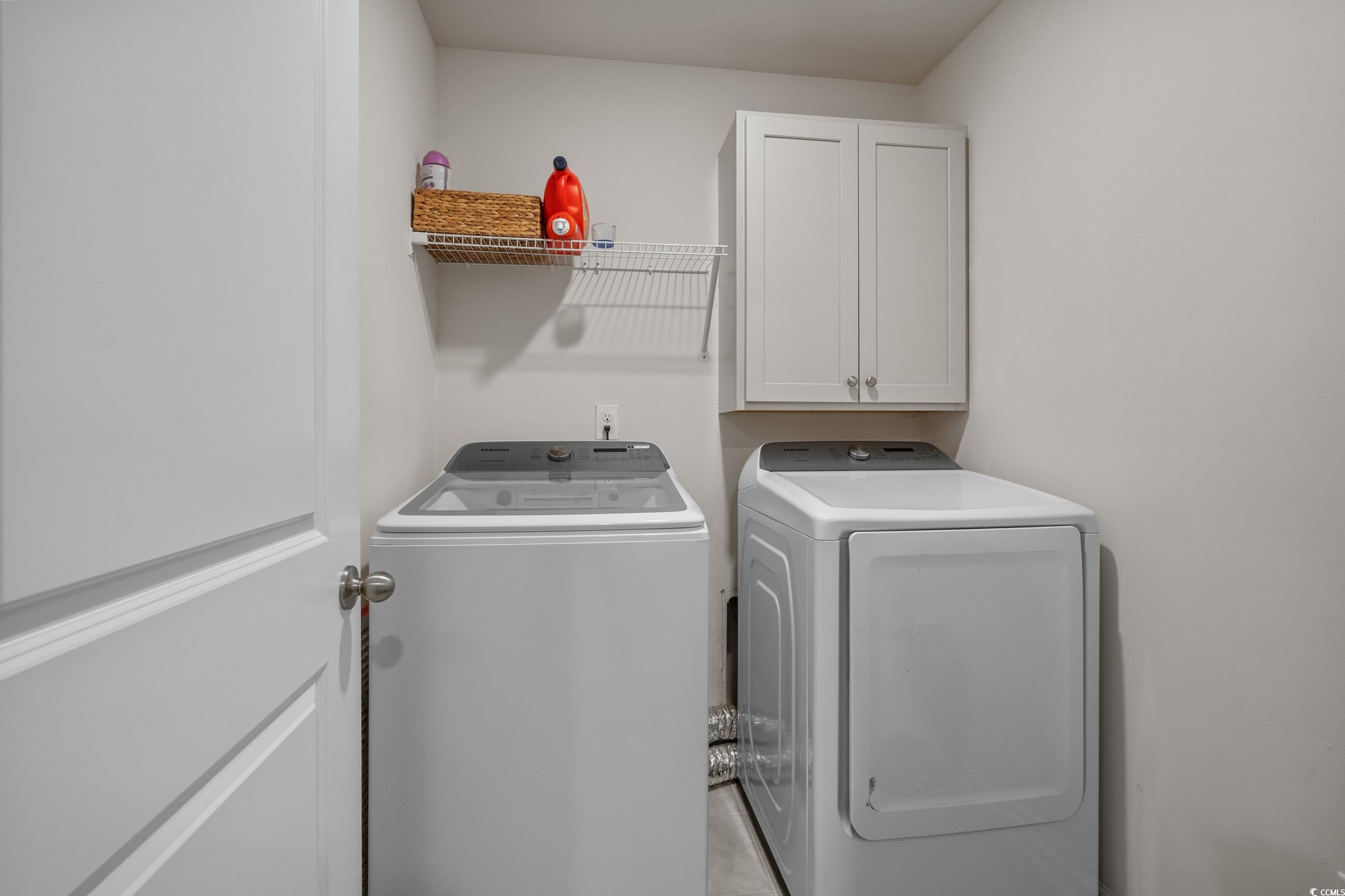3343 Bells Lake Circle Longs, SC 29568 - Photo 23 of 40 Laundry room with cabinet space and washer and clothes dryer