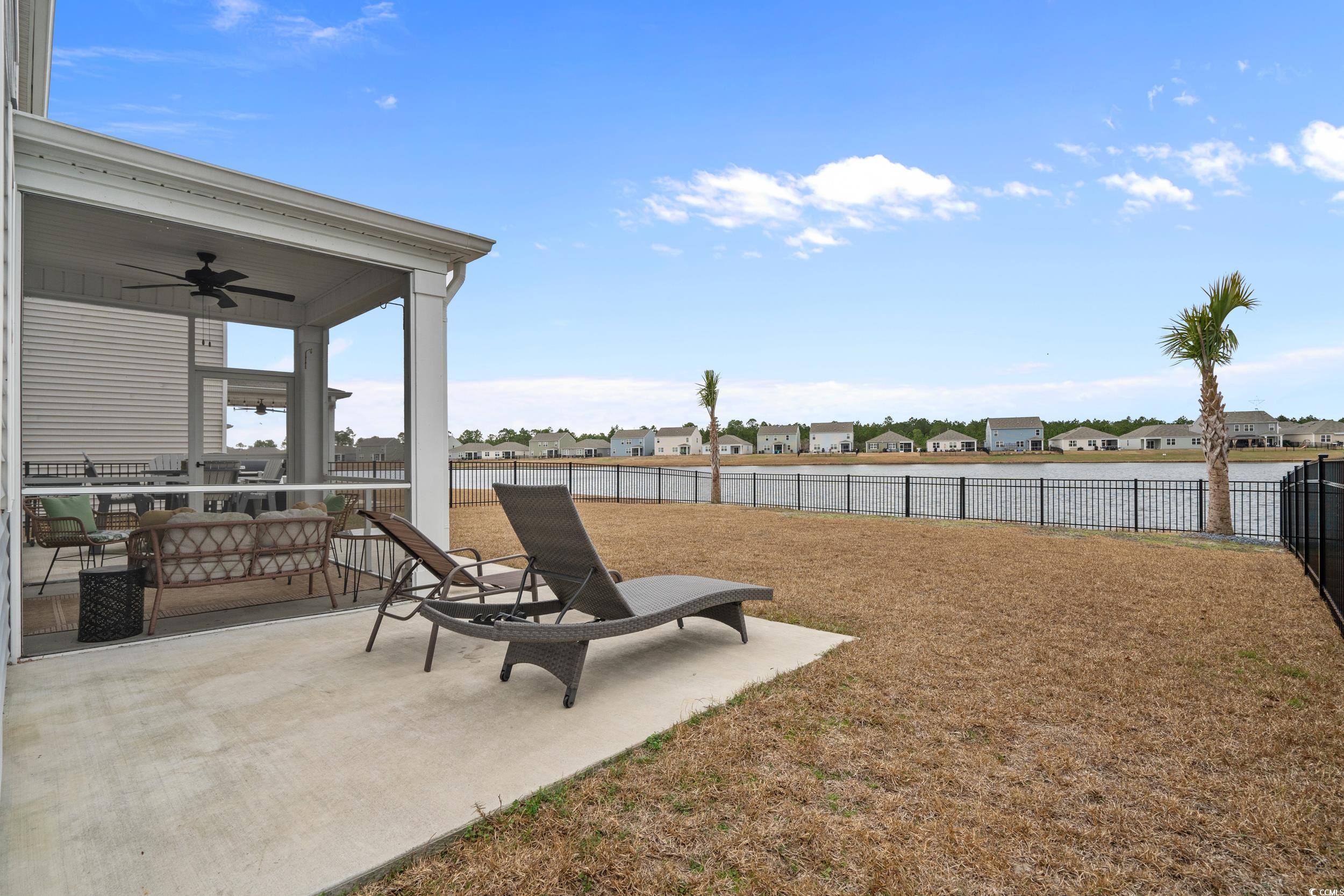 3343 Bells Lake Circle Longs, SC 29568 - Photo 27 of 40 Fenced backyard featuring ceiling fan, a patio, and a residential view