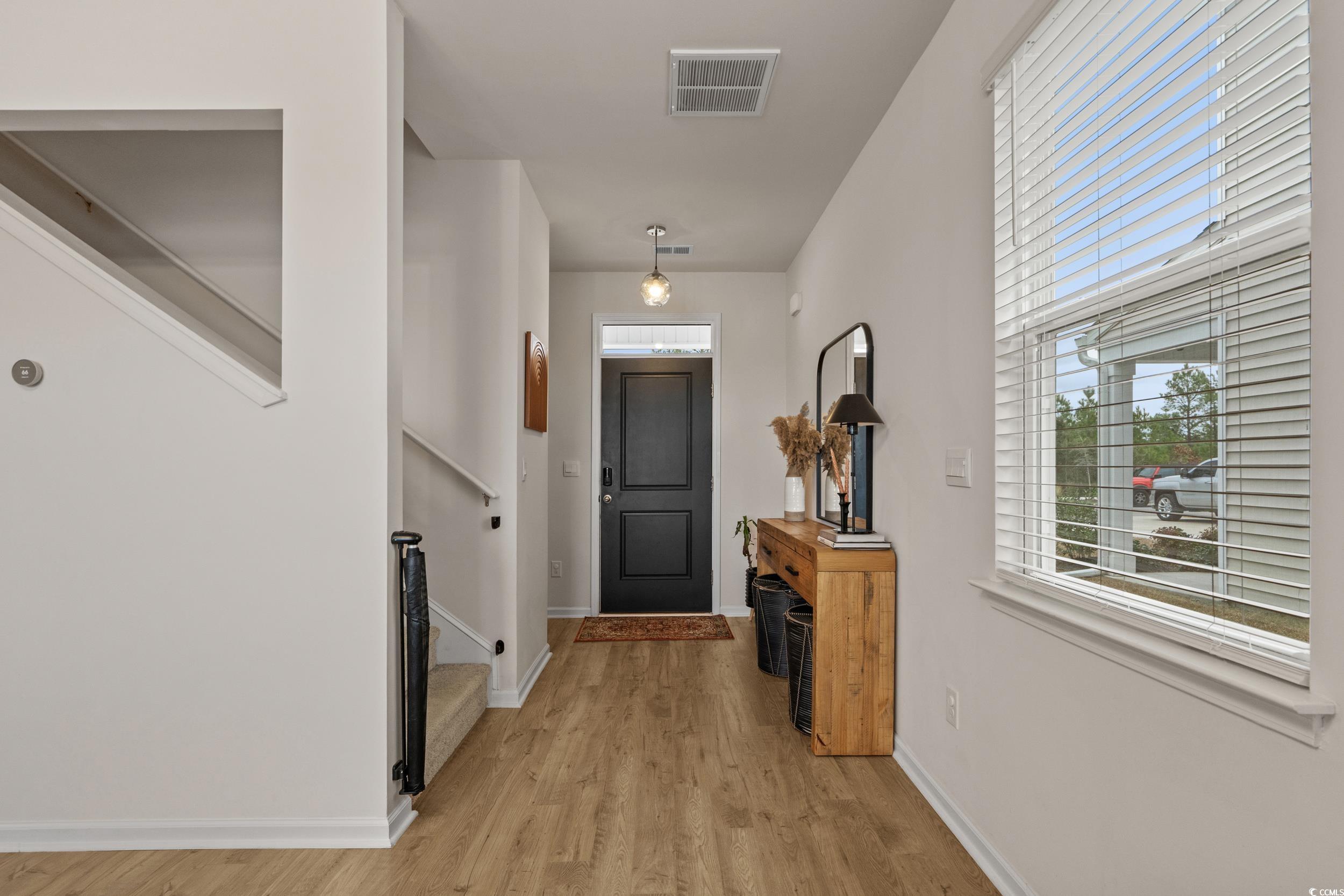 3343 Bells Lake Circle Longs, SC 29568 - Photo 5 of 40 Foyer featuring light wood-style floors and baseboards