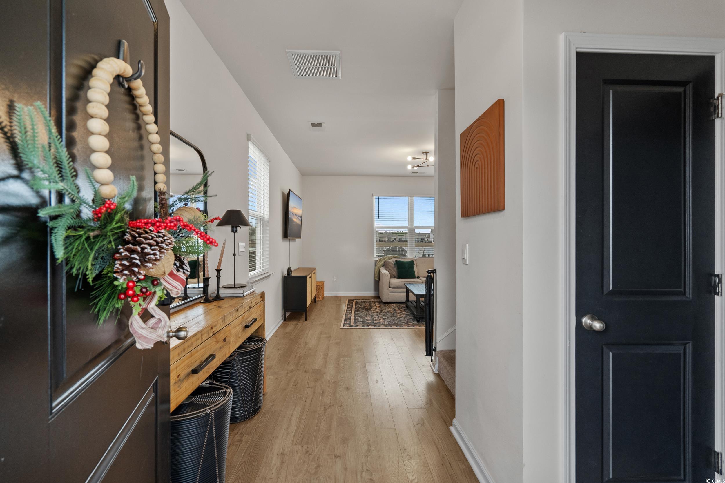 3343 Bells Lake Circle Longs, SC 29568 - Photo 6 of 40 Hallway featuring baseboards and light wood-type flooring