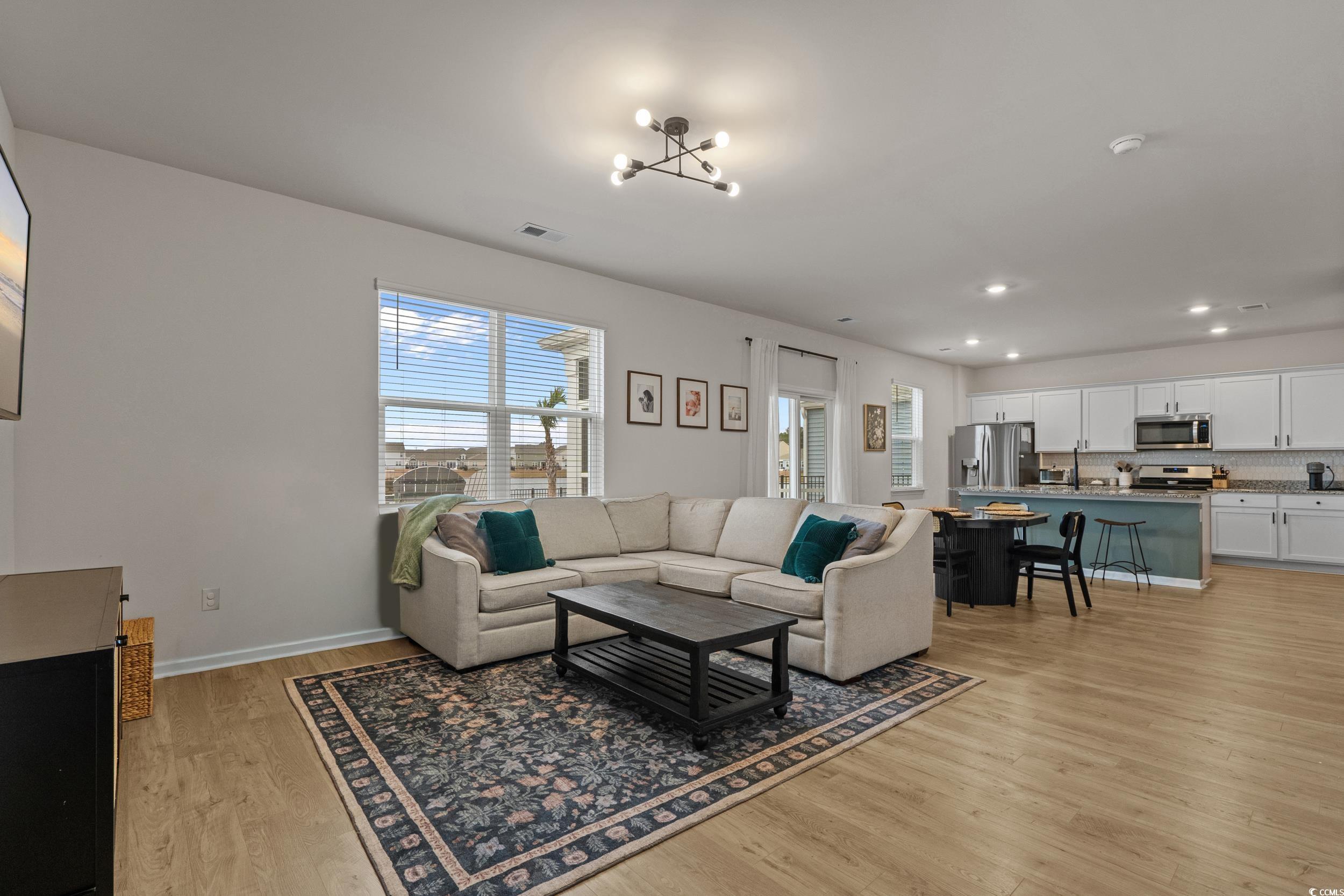 3343 Bells Lake Circle Longs, SC 29568 - Photo 9 of 40 Living area featuring recessed lighting, light wood finished floors, and a chandelier