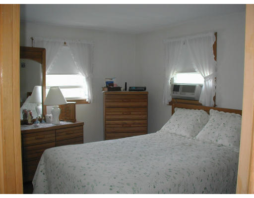 55 Summit Street Salem, MA 01970 - Photo 5 of 8 a bedroom with a bed and a dresser