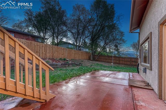 26 Mountain View Road Manitou Springs, CO 80829 - Photo 41 of 48 Large fenced backyard wraps around the side of the home and offers mountain views