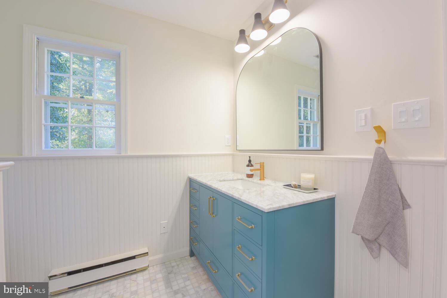 7716 Ridgecrest Drive Alexandria, VA 22308 - Photo 22 of 67 New primary bathroom w/ brass Moen Align fixtures