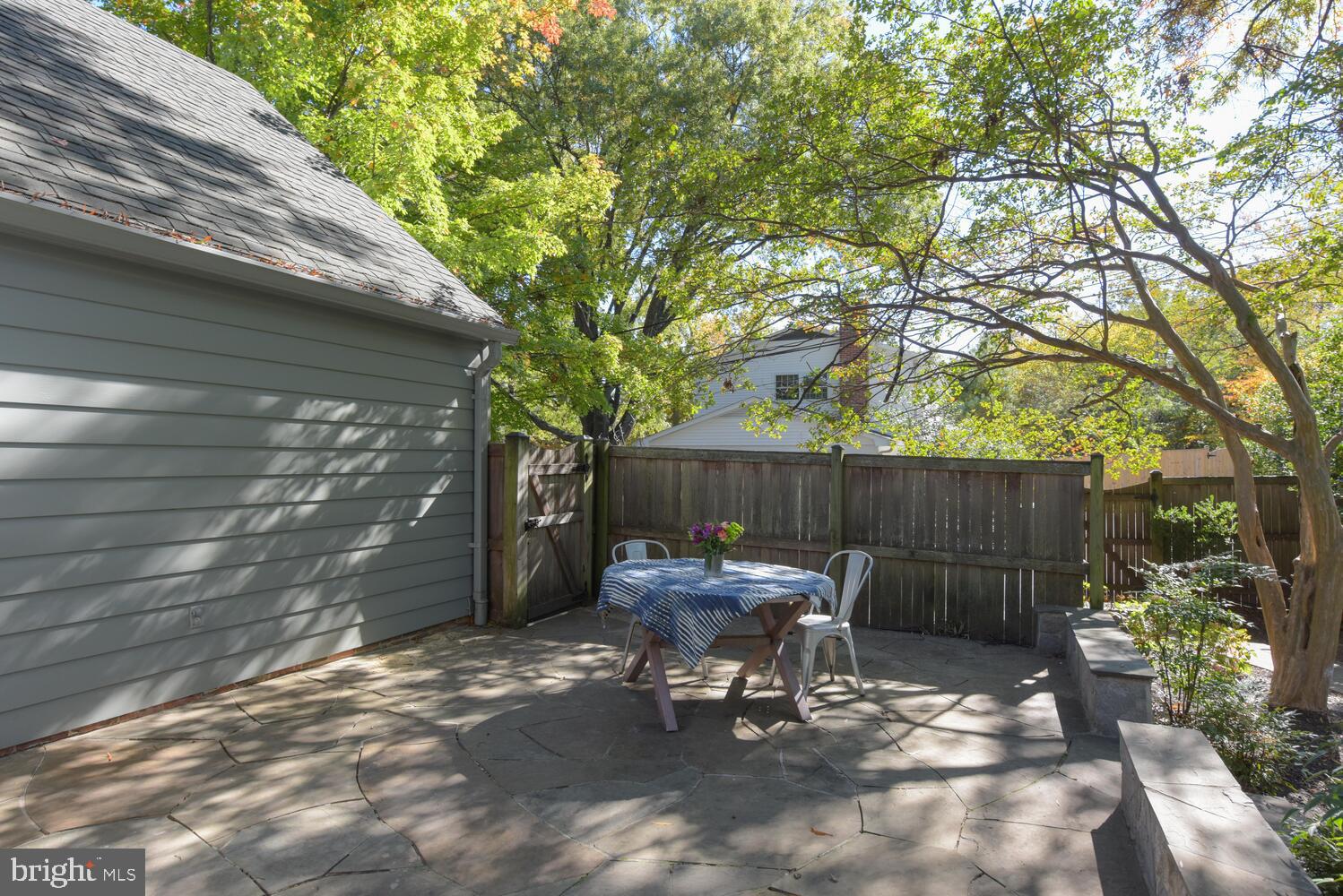 7716 Ridgecrest Drive Alexandria, VA 22308 - Photo 50 of 67 Stone patio off of bonus room, leads to garage