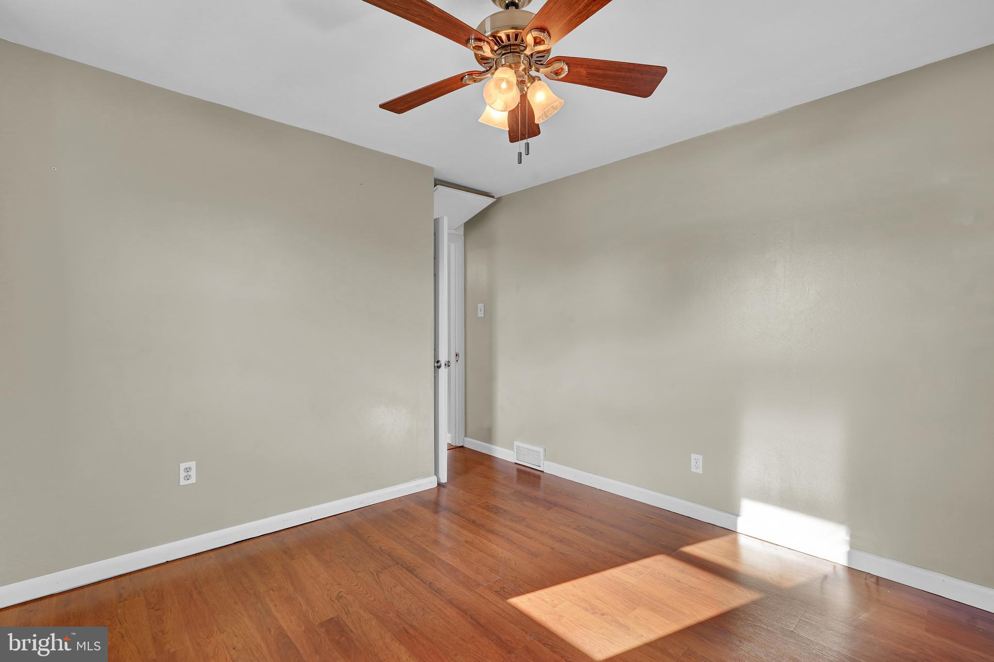 2370 Sycamore Road York, PA 17408 - Photo 16 of 24 an empty room with wooden floor and a ceiling fan