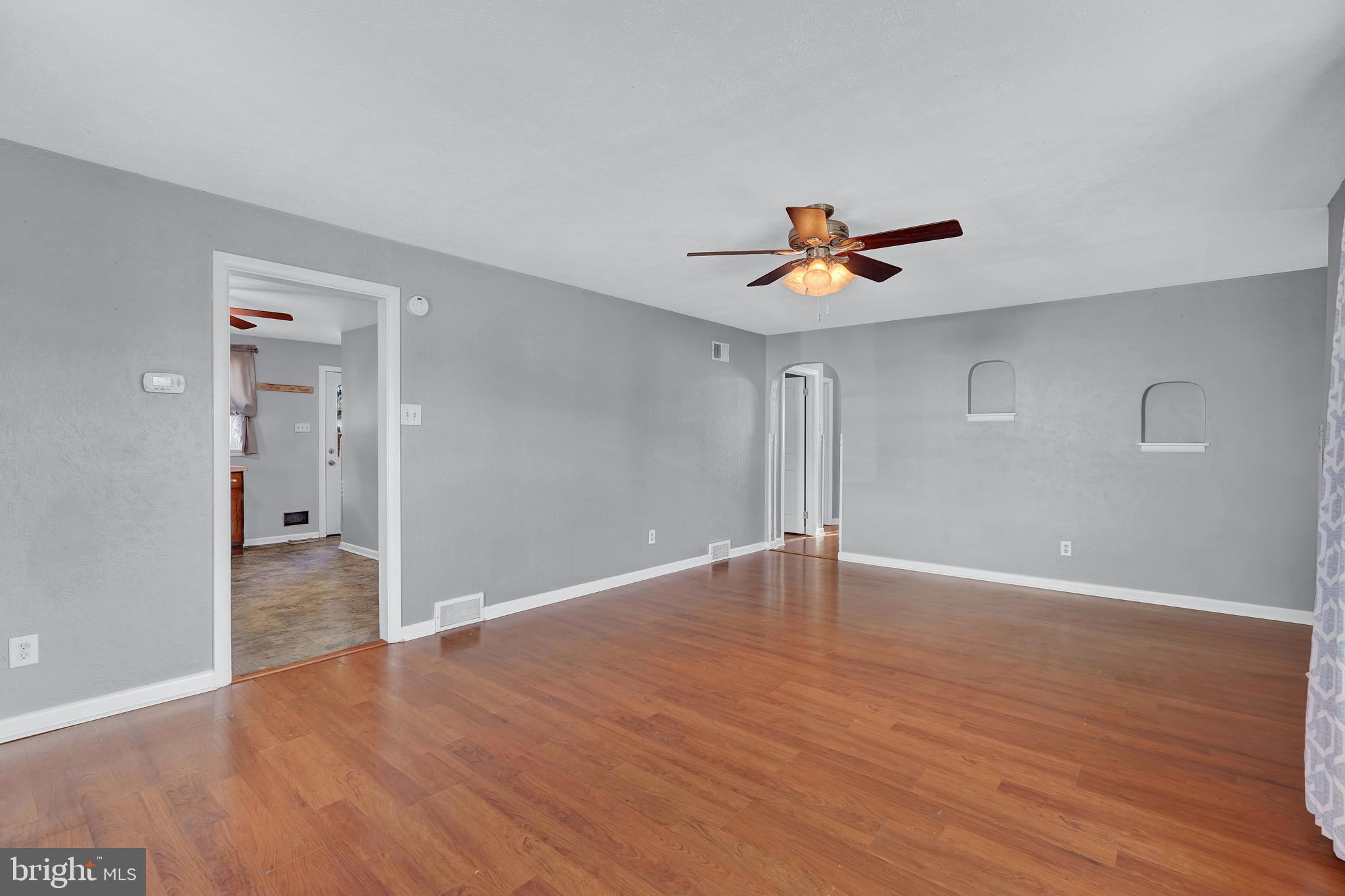 2370 Sycamore Road York, PA 17408 - Photo 8 of 24 a view of an empty room with wooden floor and a ceiling fan