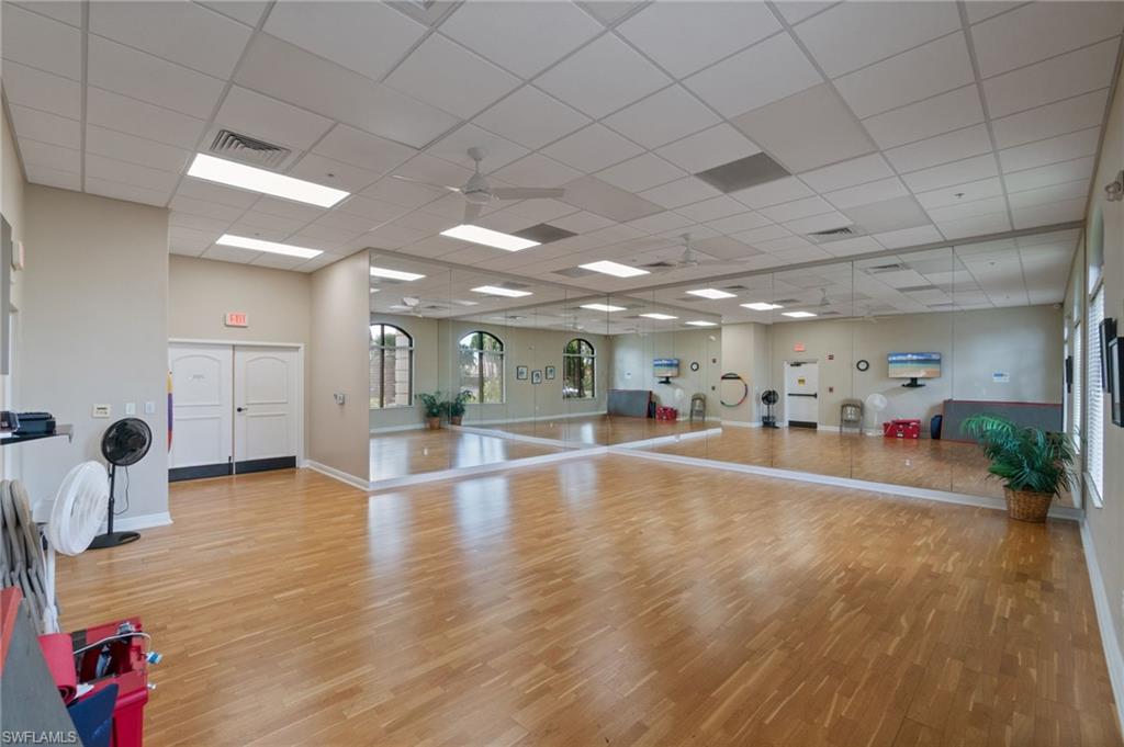 19753 Tesoro Way Estero, FL 33967 - Photo 44 of 47 a view of an empty room with kitchen and a window